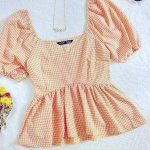 Puff sleeve ruffle hem gingham blouse